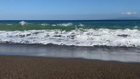 Emerald Green Waves Lapping on a Sunny Coastline5 Video stock 288086896