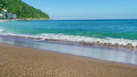 Emerald Green Waves Lapping on a Sunny Coastline3 Video stock 288091167
