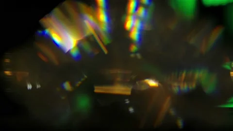 Emerald highlights and multicolored flares reflecting in the faces of a slowly Stock Footage 139617660