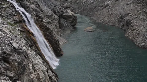 Emerald lake and waterfall Stock Footage 23569118