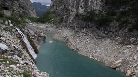 Emerald lake and waterfall Stock Footage 23569128