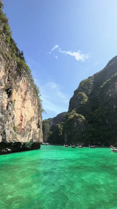 Emerald Ocean Lagoon Water With Steep Limestone Cliffs and Boats Stock Footage 341900921