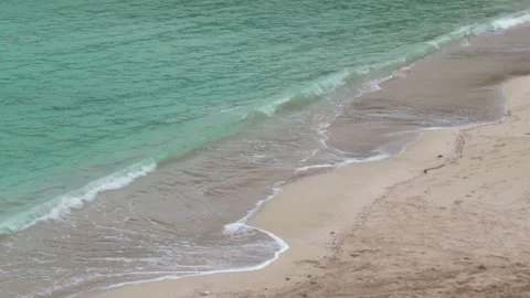 Emerald ocean waves crashing on sand beach Copy space Stock-Footage 333626071