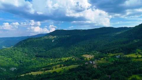 Emerald Peaks Touching the Clouds Stock Footage 314159508