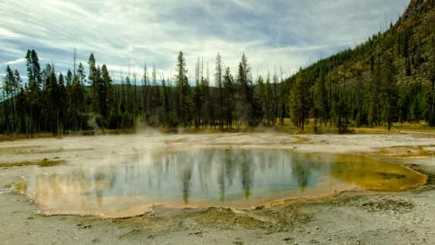 Emerald Pool in Yellowstone with Reflection of the Trees Stock Photos