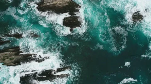 Emerald powerful waves hit the reefs in slow motion. Top-down aerial footage. Stock Footage 150069783