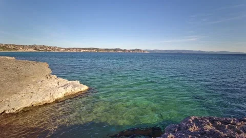 EMERALD SEA, TRANSPARENT WATER, CLIFFS Stock Footage 130221440