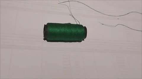 Emerald Sewing Thread Spool Lying on White Background Stock Footage 296978592