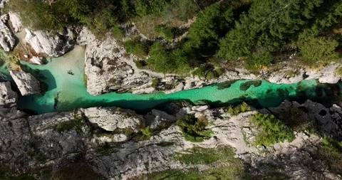 Emerald Soca River winding rocky canyon Bovec Slovenia aerial Video stock 333203369