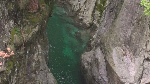 Emerald Water Pool in a Wild Mountain Canyon and Waterfall Stock Footage 84523908