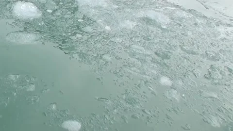 Emerald Waters Cradle Melting Ice Near an Arctic Glacier Stock Footage 340484250