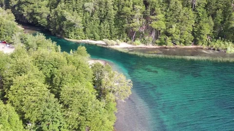 Emerald waters lake beach, on a summer road trip through the Andes 스톡 동영상 256183345