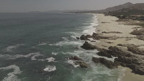 Emerald Waves Exploding into Rocks Stock Footage 279775741