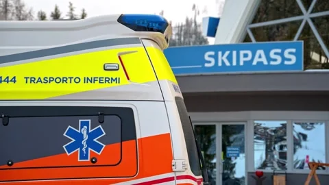 Emergency ambulance parked in front of ski resort skipass office building a.. Stock Footage 339656061