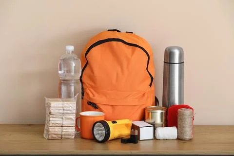 Emergency backpack and necessities on table at home Stock Photos