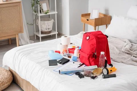 Emergency backpack with necessities in room Stock Photos