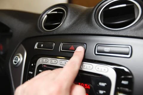 Emergency button on car dashboard Stock Photos