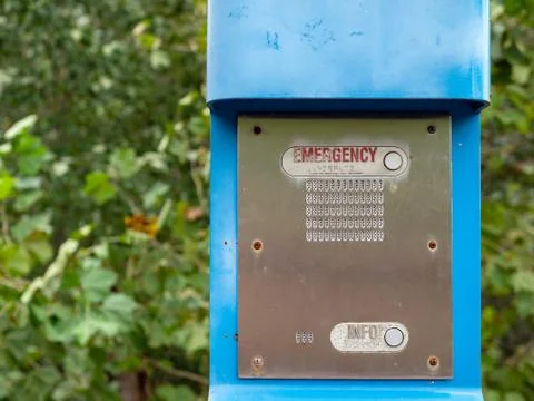 Emergency button, info button and speaker on a blue emergency post Foto stock