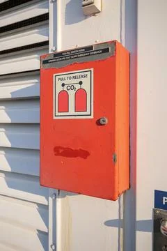 Emergency CO2 fire suppression pull station box on utility wall Stock Photos