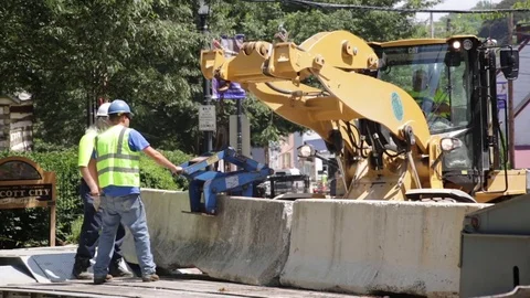 Emergency construction services at a disaster site setting up road blocks. Stock Footage 70538442