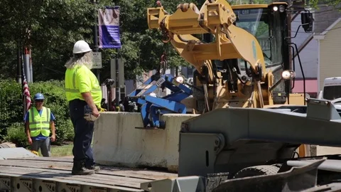 Emergency construction services at a disaster site setting up road blocks. Stock Footage 70538604