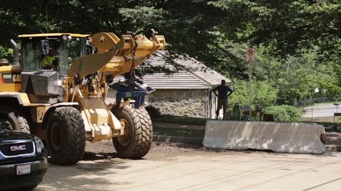 Emergency construction services at a disaster site setting up road blocks. Stock Footage 70539479