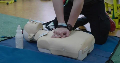Emergency CPR demonstration on a dummy mannequin Stock Footage 126200680