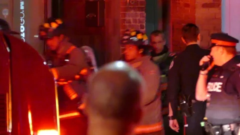 Emergency crews doing CPR while moving stretcher Stock Footage 77895128