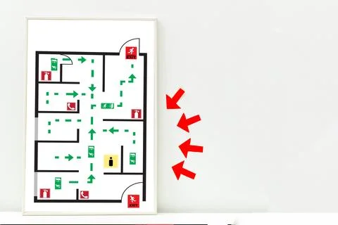 Emergency evacuation plan for a building with marked exits and routes Stock Photos