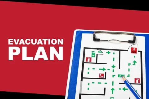 Emergency evacuation plan displayed on a clipboard with clear pathways and exit Stock Photos
