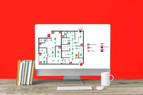Emergency evacuation plan displayed on a computer screen in an office setting Stock Photos