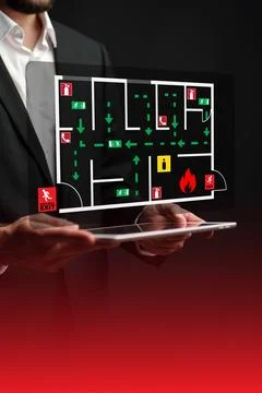 Emergency evacuation plan displayed on tablet for building safety procedures Stock Photos