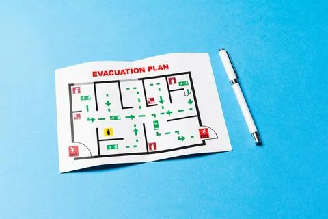 Emergency evacuation plan showing escape routes and exits in building layout Stock Photos