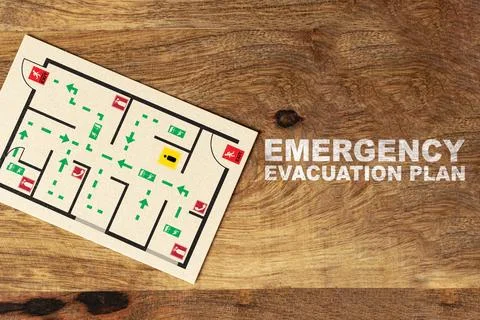 Emergency evacuation plan showing exit routes and safety information for a Stock Photos