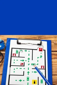 Emergency evacuation plan showing exit routes and safe areas for public spaces Stock Photos