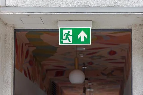 Emergency Exit Direction Sign Stock Photos