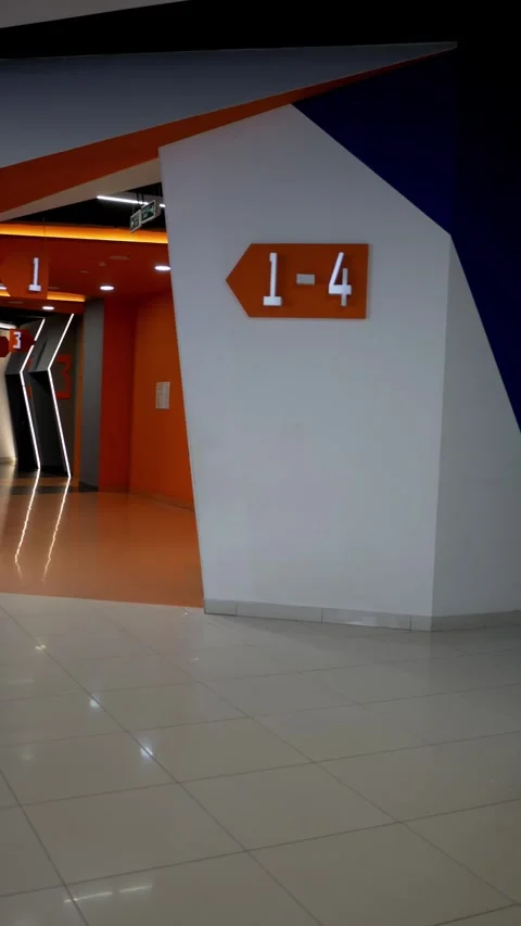 Emergency exit door and fire extinguisher at movie theater. Exit doors in movie Video stock 283448029