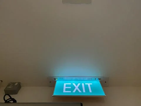 Emergency Exit Door with light on Stock Photos