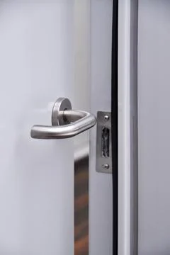 Emergency exit door, lock system and door handle Stock Photos