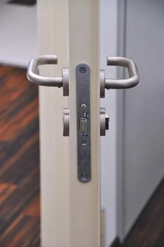 Emergency exit door, lock system and door handle Stock Photos