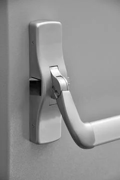 Emergency exit door. Push bar and rail for panic exit Stock Photos