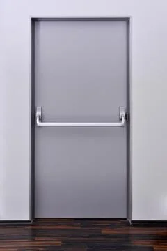 Emergency exit door. Push bar and rail for panic exit Stock Photos