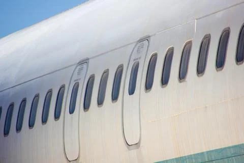Emergency Exit Hatches And Window Ports On Passenger Plane Stock Photos