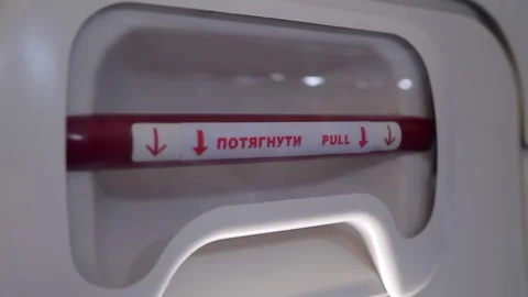 Emergency exit on the plane. emergency exit indicator. Stock Footage 130517289