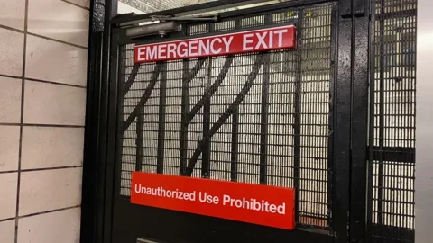 Emergency Exit Sign and Unauthorized Use Prohibited Sign in New York City S.. Stock Footage 228690812