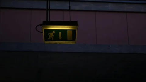 Emergency exit sign during simulation of an earthquake shake Stock Footage 108797499