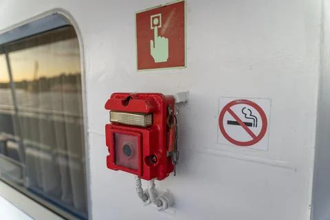 Emergency fire alarm button on the ship. Stock Photos