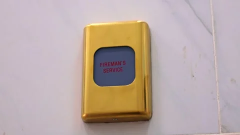 Emergency fire alarm switch with Fireman's service text on the wall Stock Footage 264967522