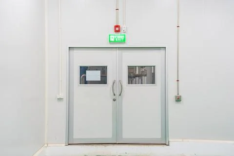 Emergency fire exit door white clean new fire extinguisher fire alarm Stock Photos