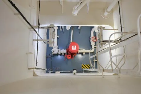 Emergency fire pump in engine room of cargo ship Stock Photos